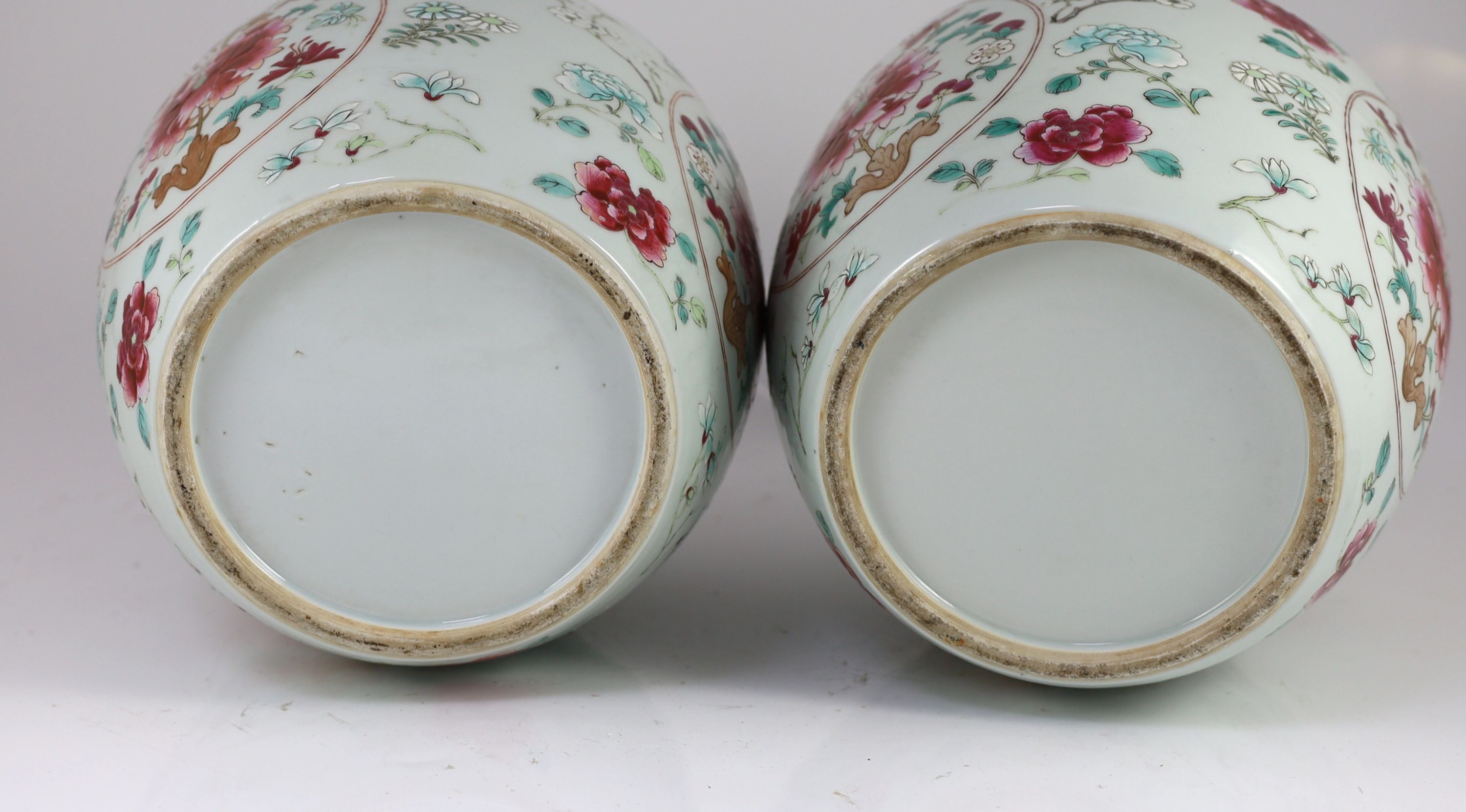 A good pair of Chinese famille rose ovoid jars and covers, 19th century, 28.5 cm high